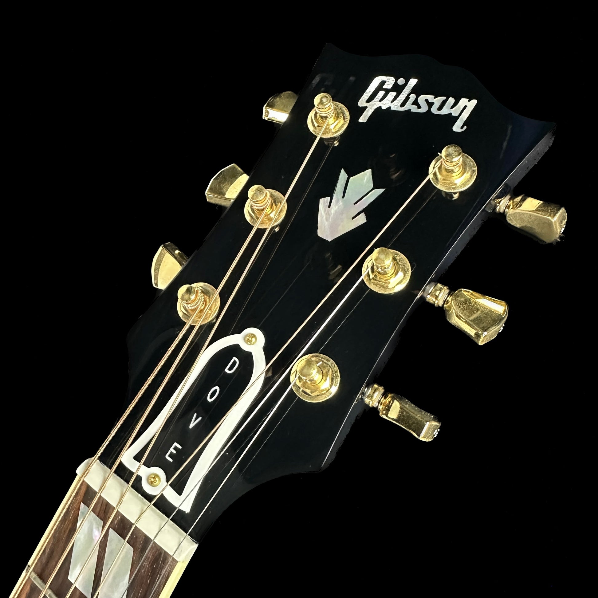 Front of headstock of Used Gibson Dove Viper Blue.