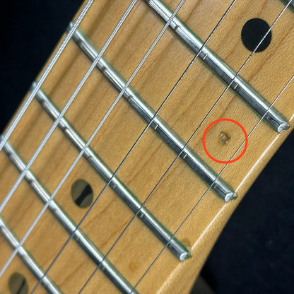 Small ding on fretboard of Used 1997 Fender Lone Star Strat HSS Shoreline Gold.