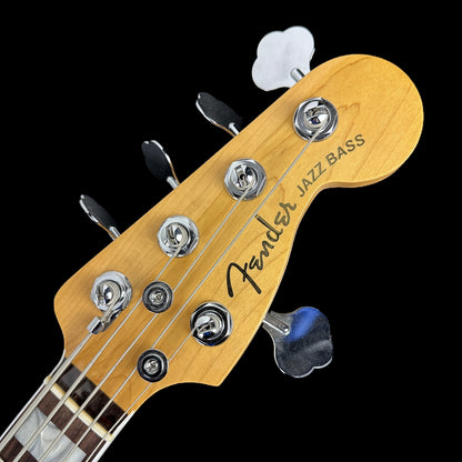 Front of headstock of Used Fender American Ultra Jazz V Bass RW 3-Color Sunburst.