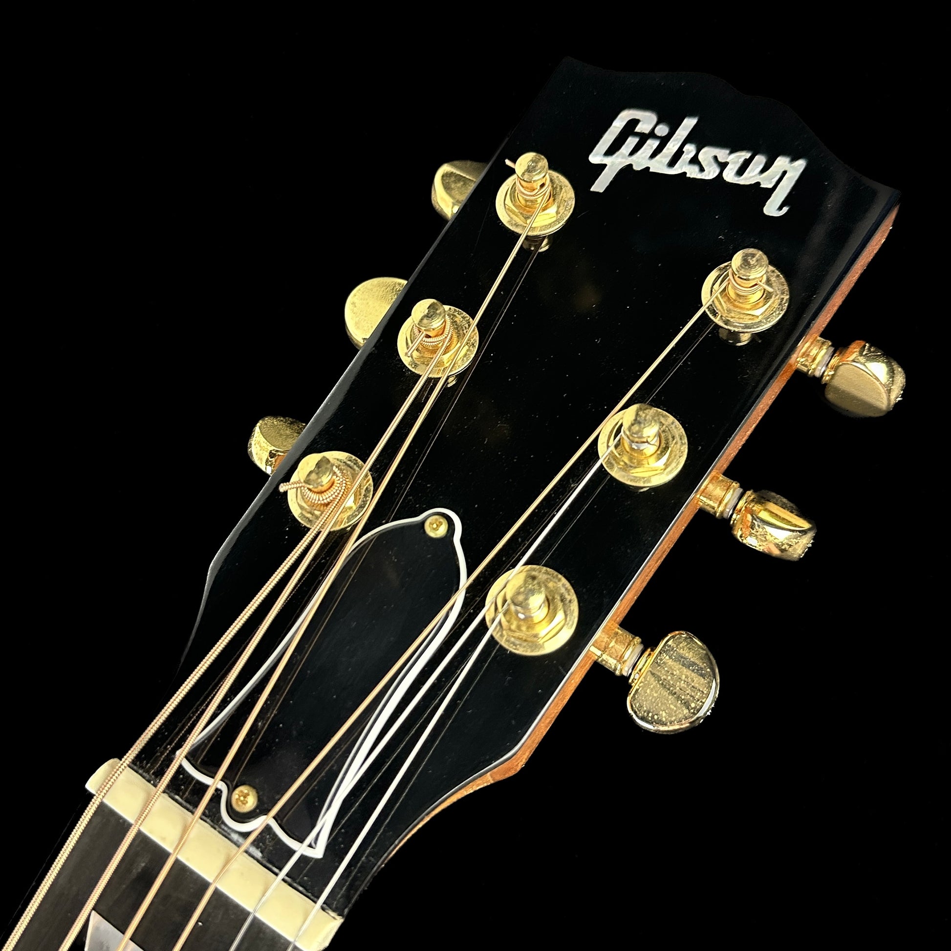 Front of headstock of Used Gibson Hummingbird M Rosewood Burst.