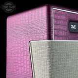 Close-up of a pink textured amplifier with a brand logo on a black background