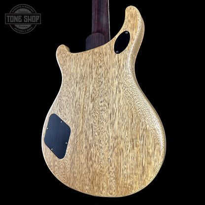 Wooden guitar body with 'Tone Shop' logo in the corner