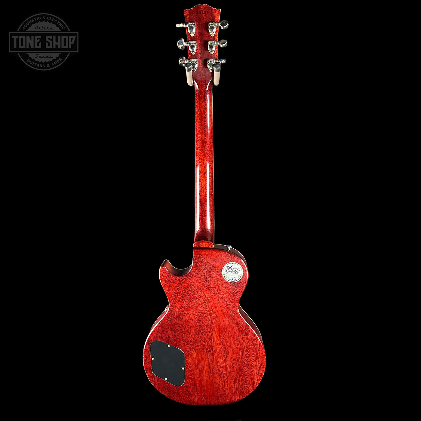 Red electric guitar on a black background with 'Tone Shop' logo.