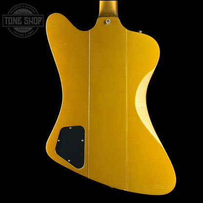 Gold electric guitar body with 'Tone Shop' logo in the corner