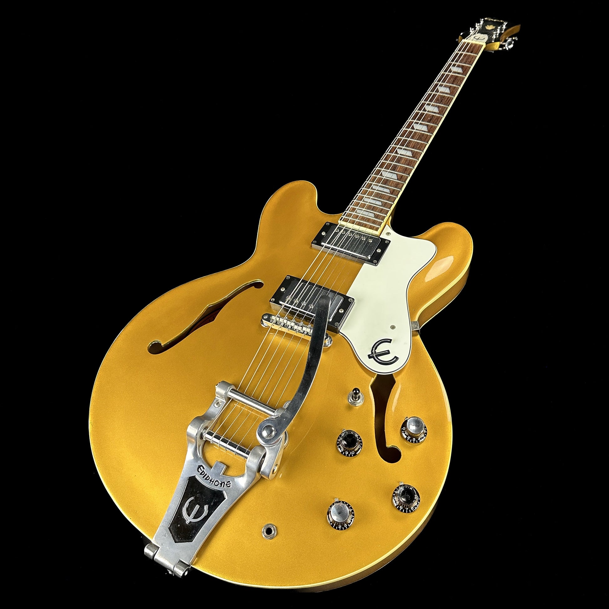 Front angle of Used Epiphone Riviera w/bigsby Gold Sparkle.