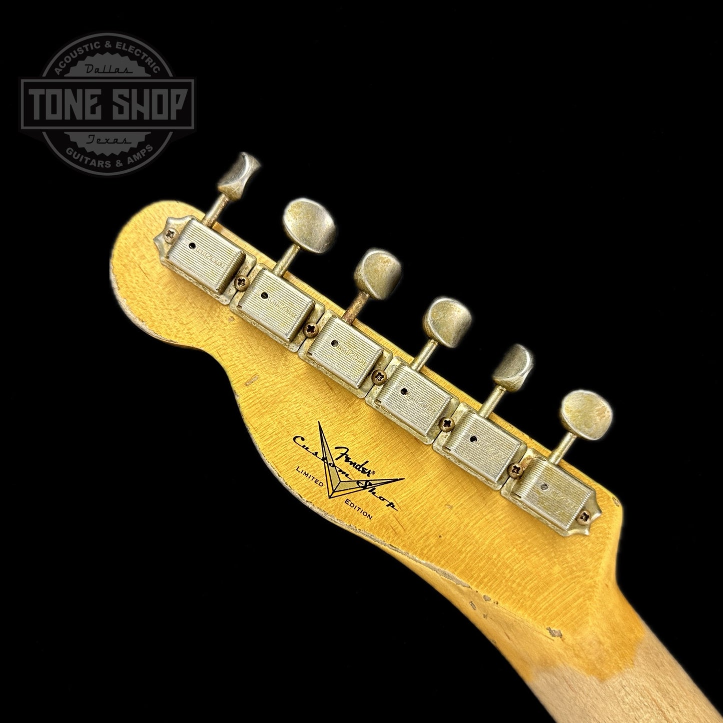 Back of headstock of Fender Custom Shop Limited Edition Reverse '60 Tele Custom Heavy Relic Aged Black Over 3 Color Sunburst.