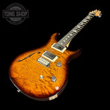 Front angle of PRS Paul Reed Smith CE24 Semi-Hollow Quilt Black Amber.