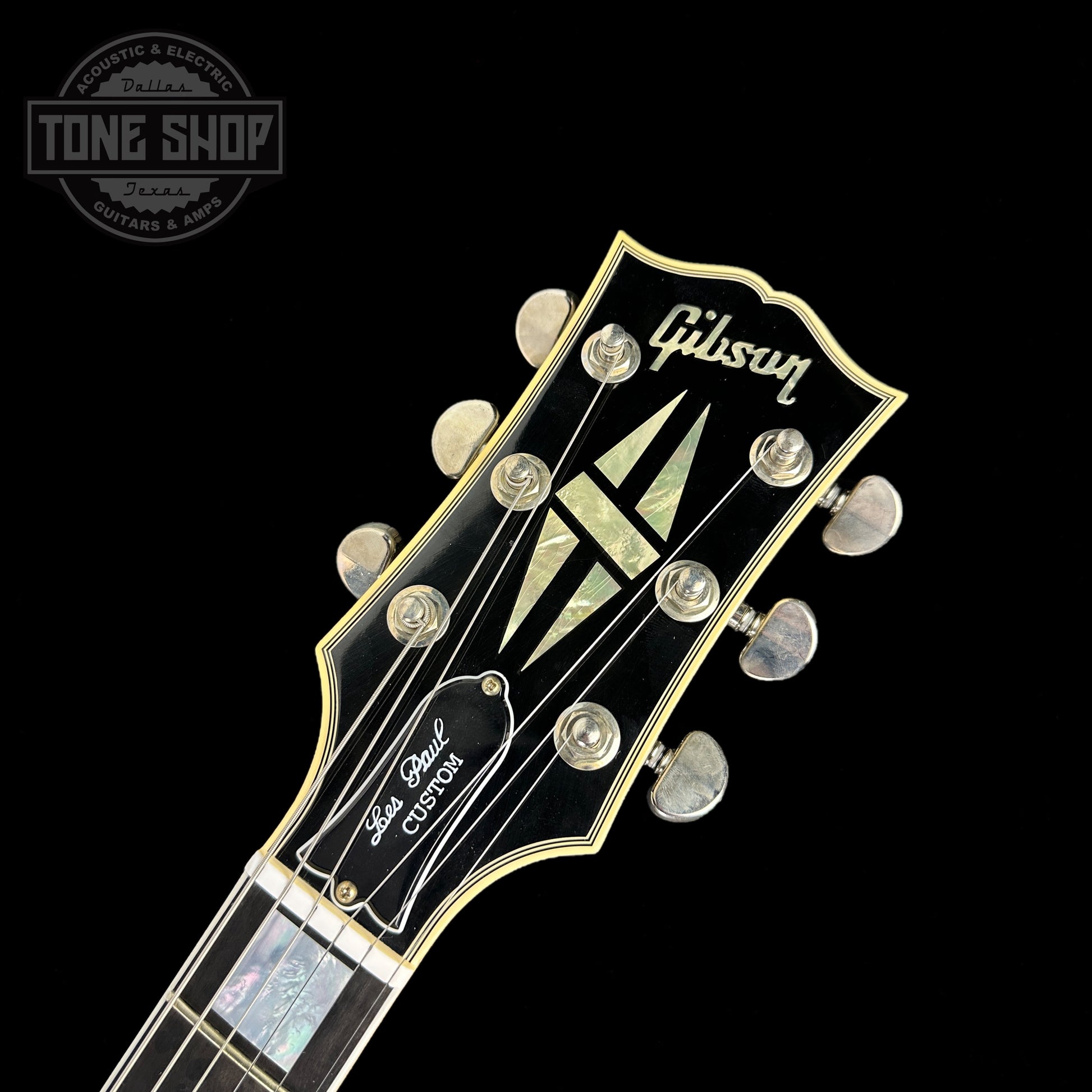 Front of headstock of Gibson Custom Shop Murphy Lab M2M Les Paul Custom Chambered Antique Silverburst Ultra Light Aged NH.