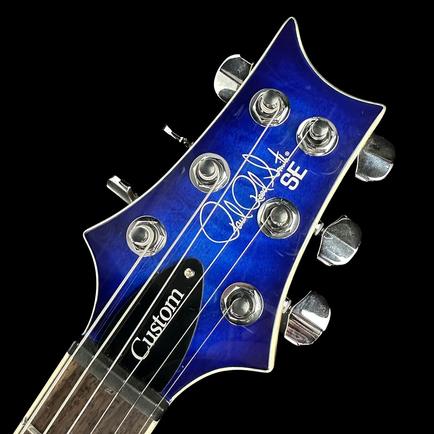Front of headstock of Used PRS SE Custom 22 Semi-Hollow Blue.