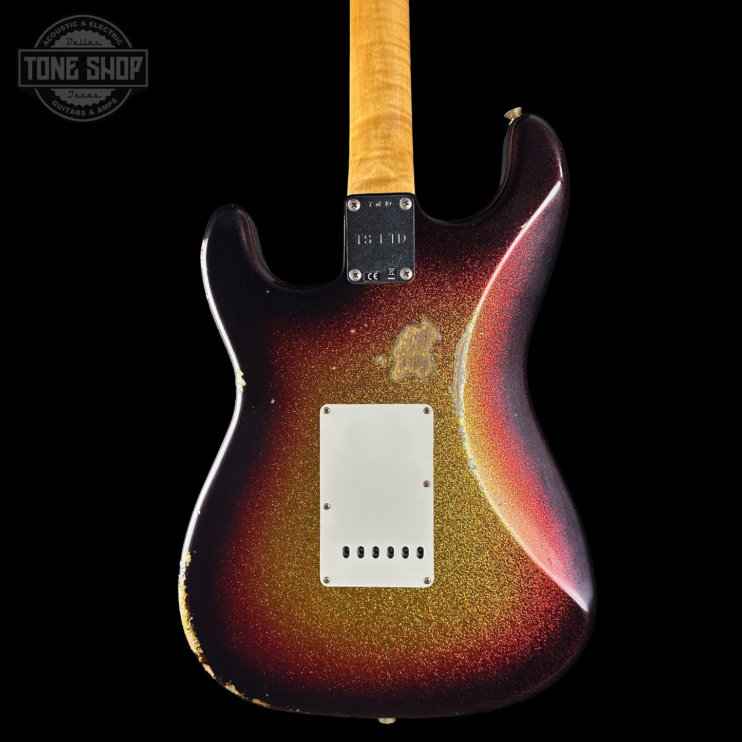 Electric guitar with a sunburst finish on a black background, featuring the Tone Shop logo.