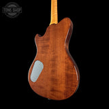 Wooden guitar body with a visible brand logo in the corner