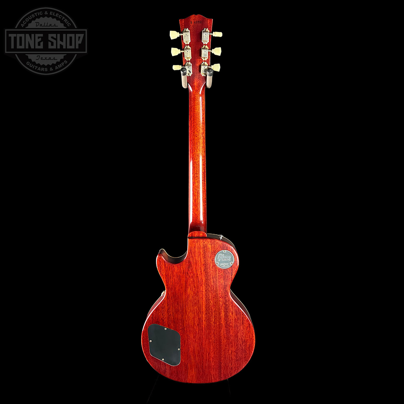 Red electric guitar on a black background with 'Tone Shop' logo.