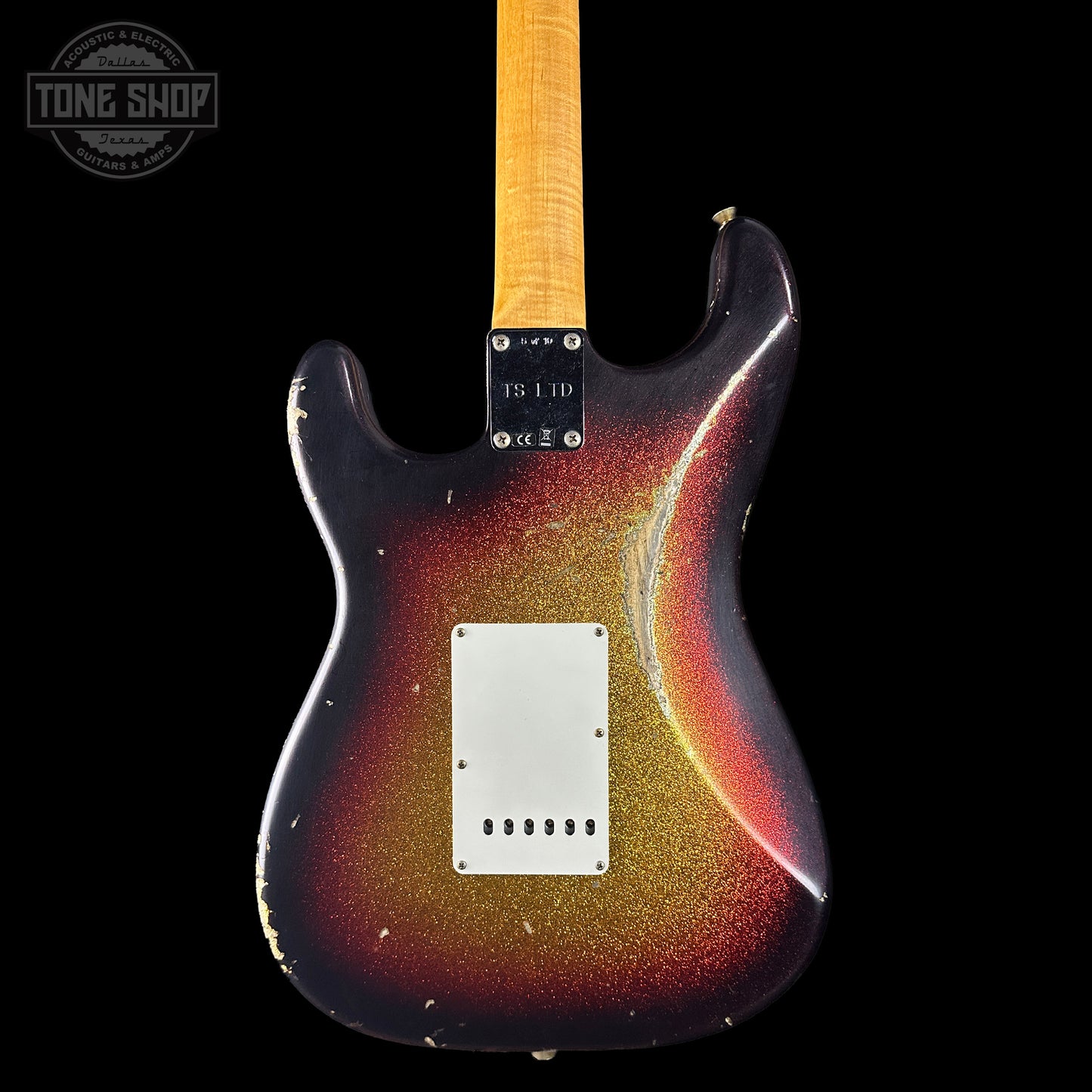 Electric guitar with a sunburst finish on a black background, featuring the Tone Shop logo.