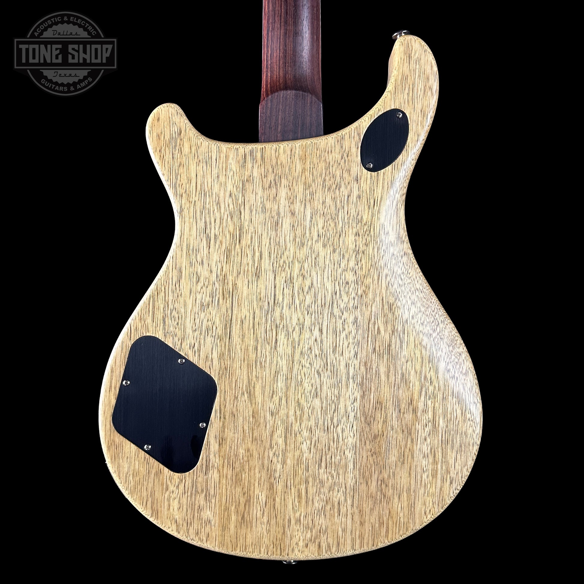 Back view of a guitar body with a visible brand logo in the corner.