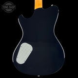 Back view of a black electric guitar with a visible brand logo in the corner.