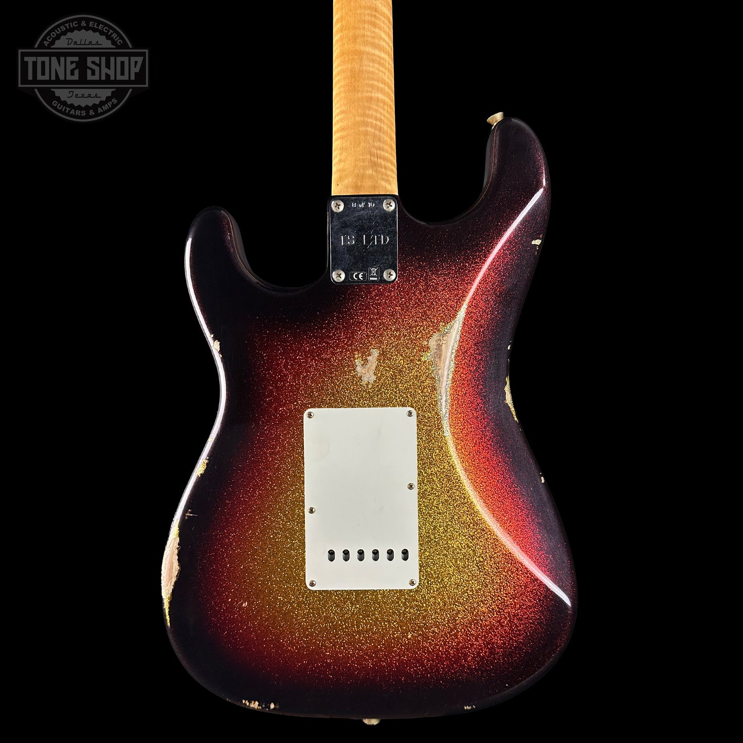 Electric guitar with a sunburst finish on a black background, featuring the Tone Shop logo.
