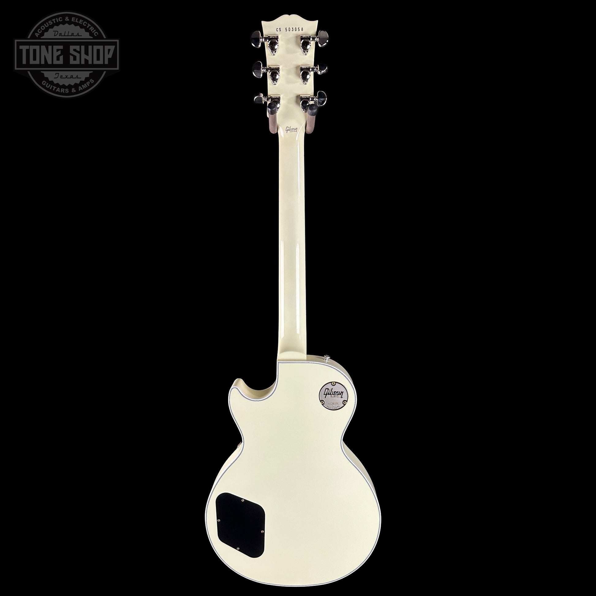 White electric guitar on a black background with 'Tone Shop' logo.
