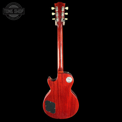 Red electric guitar on a black background with 'Tone Shop' logo.