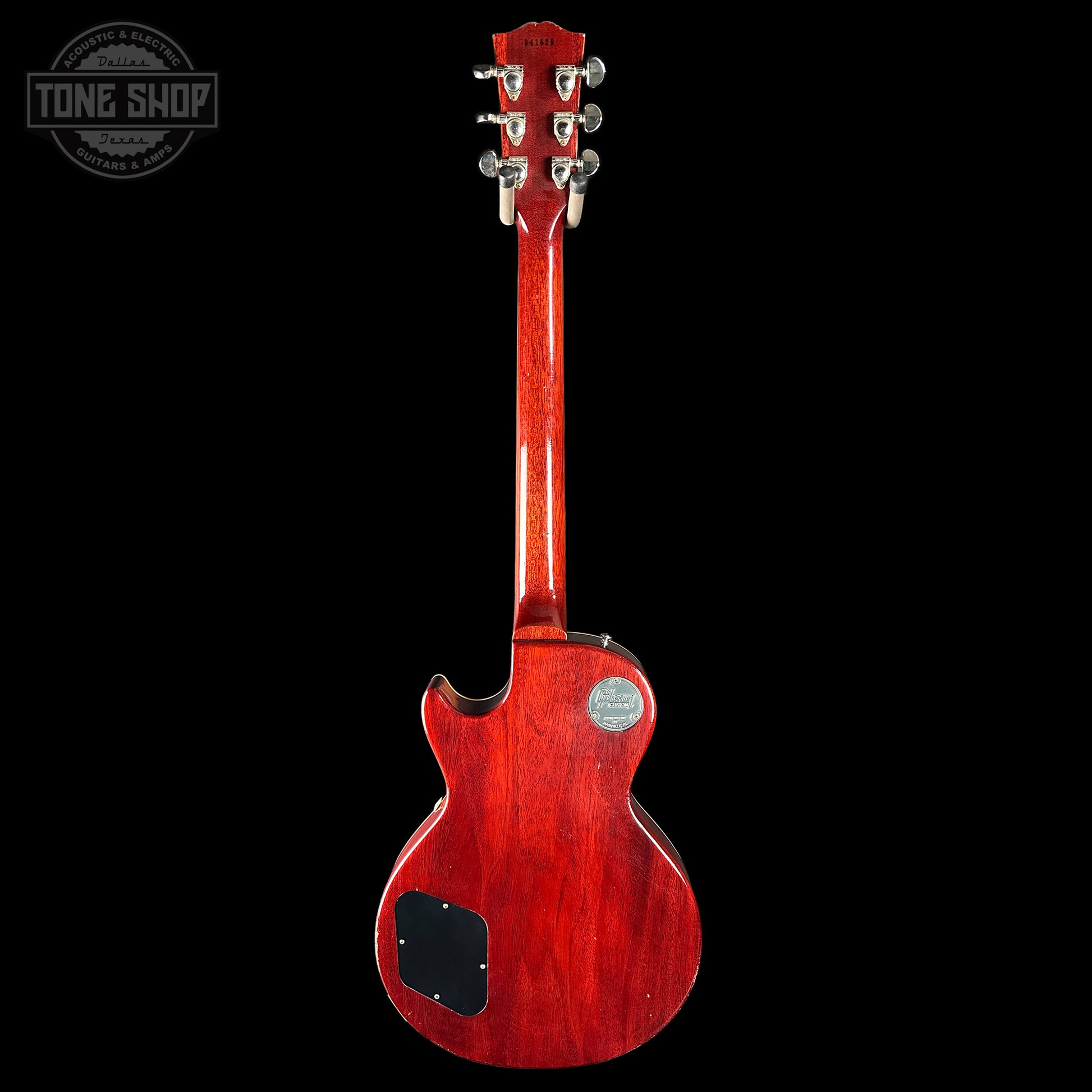 Red electric guitar on a black background with 'Tone Shop' logo.