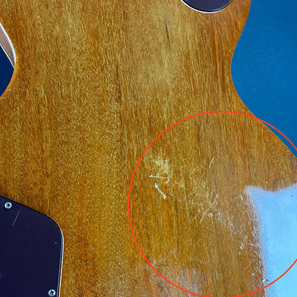 Scratches on back of body of Vintage 1977 Gibson Les Paul Deluxe Natural.