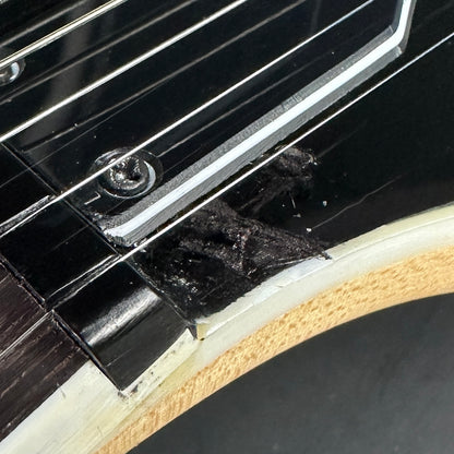 Damage on front of headstock.