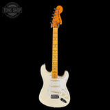 White electric guitar with a maple neck on a black background, featuring the 'Tone Shop' logo.