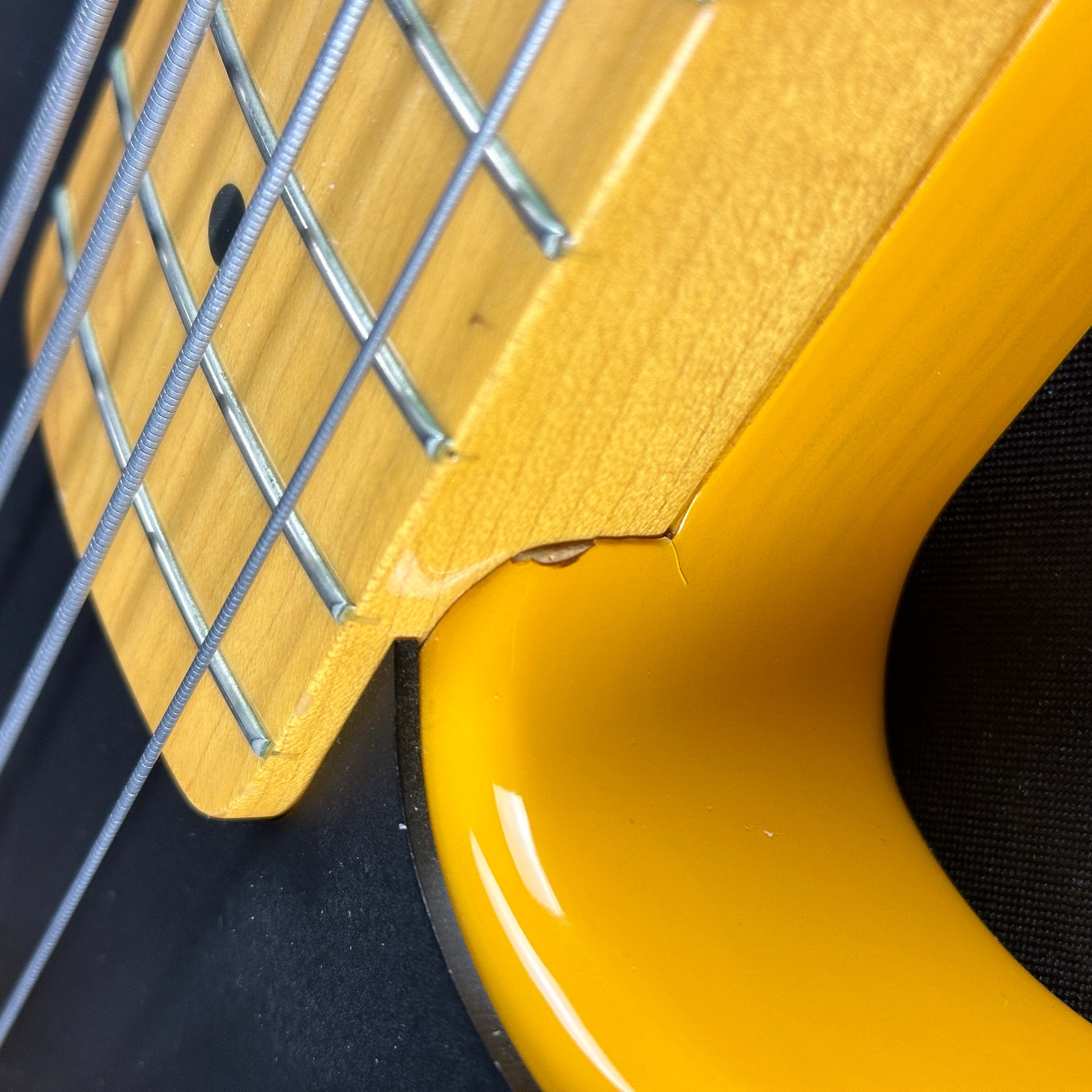 Damage near neck joint of Used Fender CIJ '51 Precision Bass.