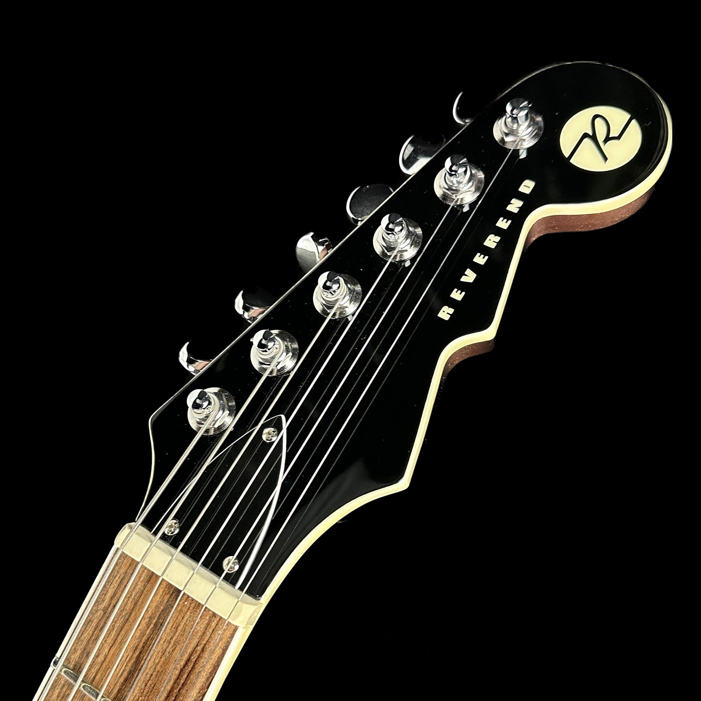 Front of headstock of Used Reverend Warhawk DA Mulberry Mist.