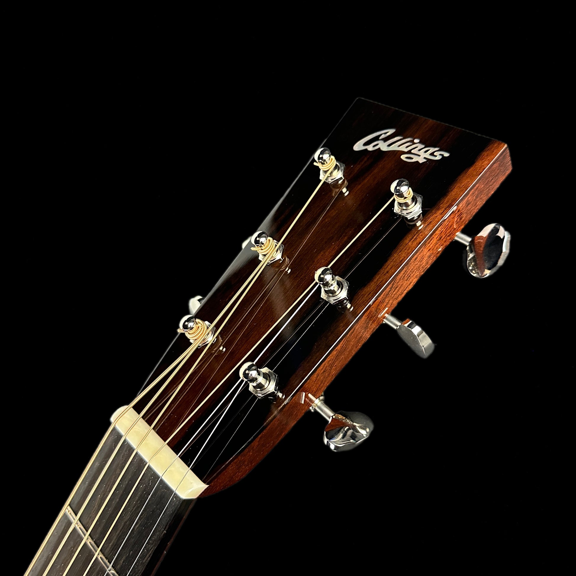 Front of headstock of Collings OM2H Natural.