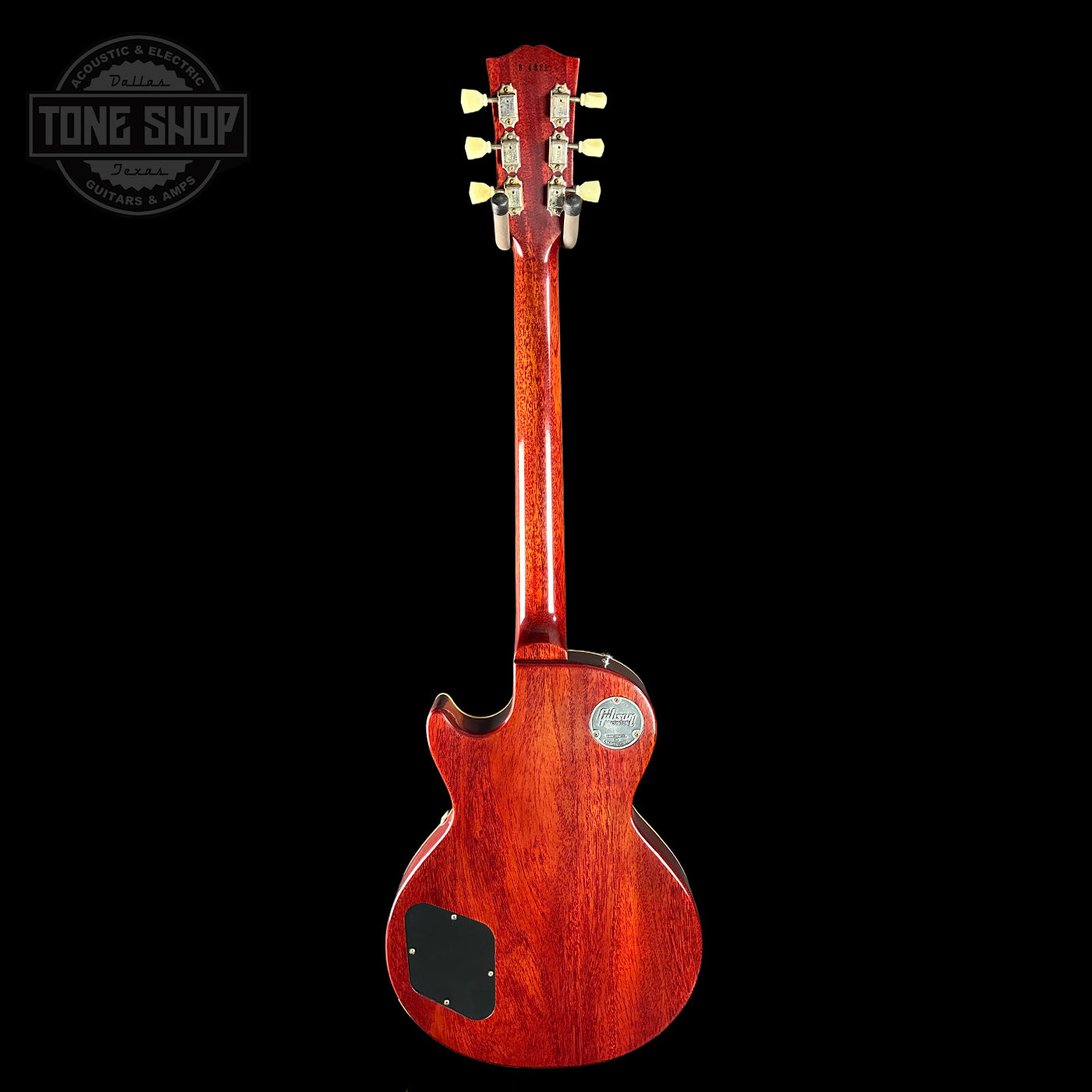 Red electric guitar on a black background with 'Tone Shop' logo.