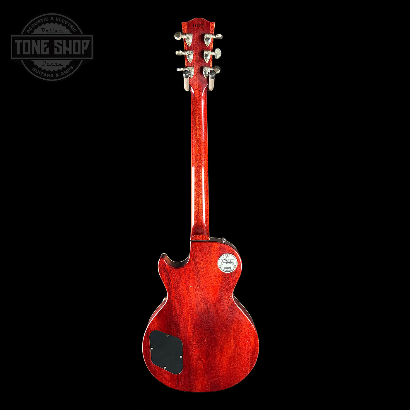 Red electric guitar on a black background with 'Tone Shop' logo.