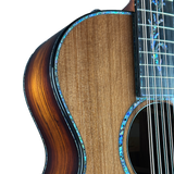 Close-up of a wooden acoustic guitar with a focus on the neck and body.