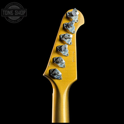 Guitar headstock with tuning pegs on a black background, featuring the Tone Shop logo.