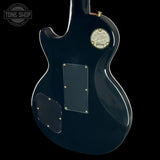 Gibson electric guitar with 'Tone Shop' logo in the corner
