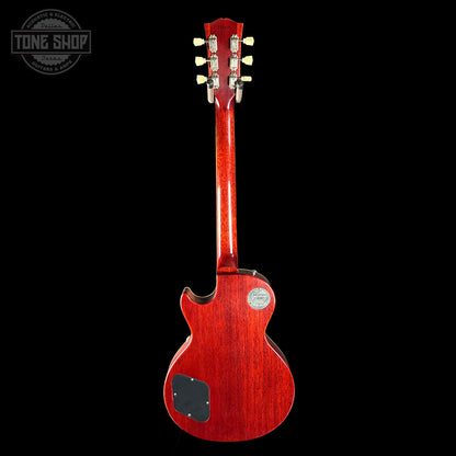 Red electric guitar on a black background with 'Tone Shop' logo.