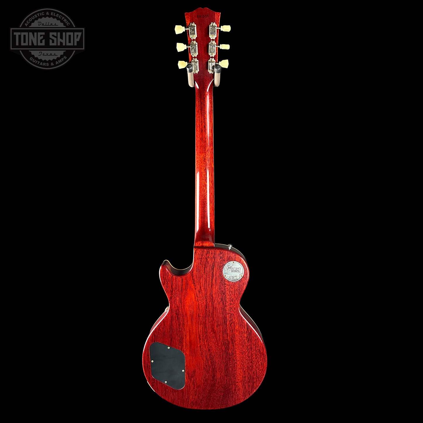 Red electric guitar on a black background with 'Tone Shop' logo.