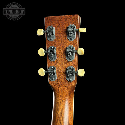 Guitar headstock with tuning pegs on a black background, featuring the Tone Shop logo.
