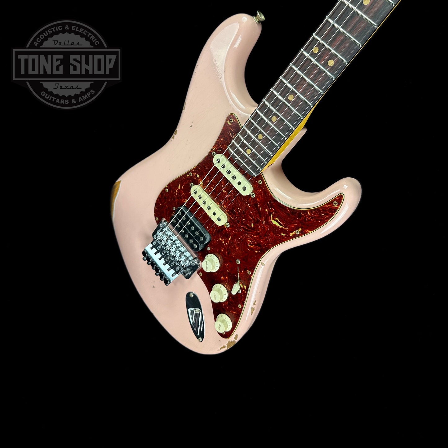 Front angle of Fender Custom Shop 69 Stratocaster Relic HSS Shell Pink Reverse Headstock.