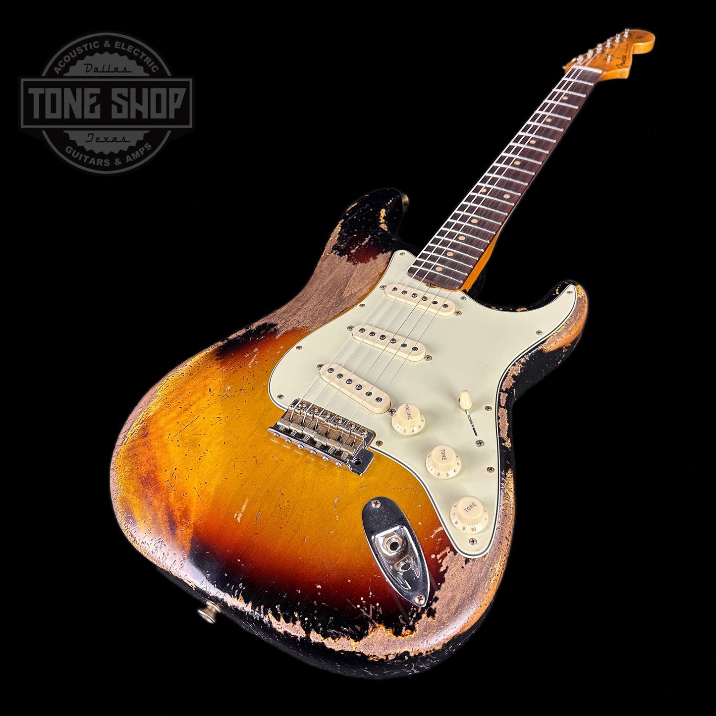 Front angle of Fender Custom Shop Limited Edition 61 Bone Tone Strat Super Heavy Relic Super Faded Aged 3 Color Sunburst.
