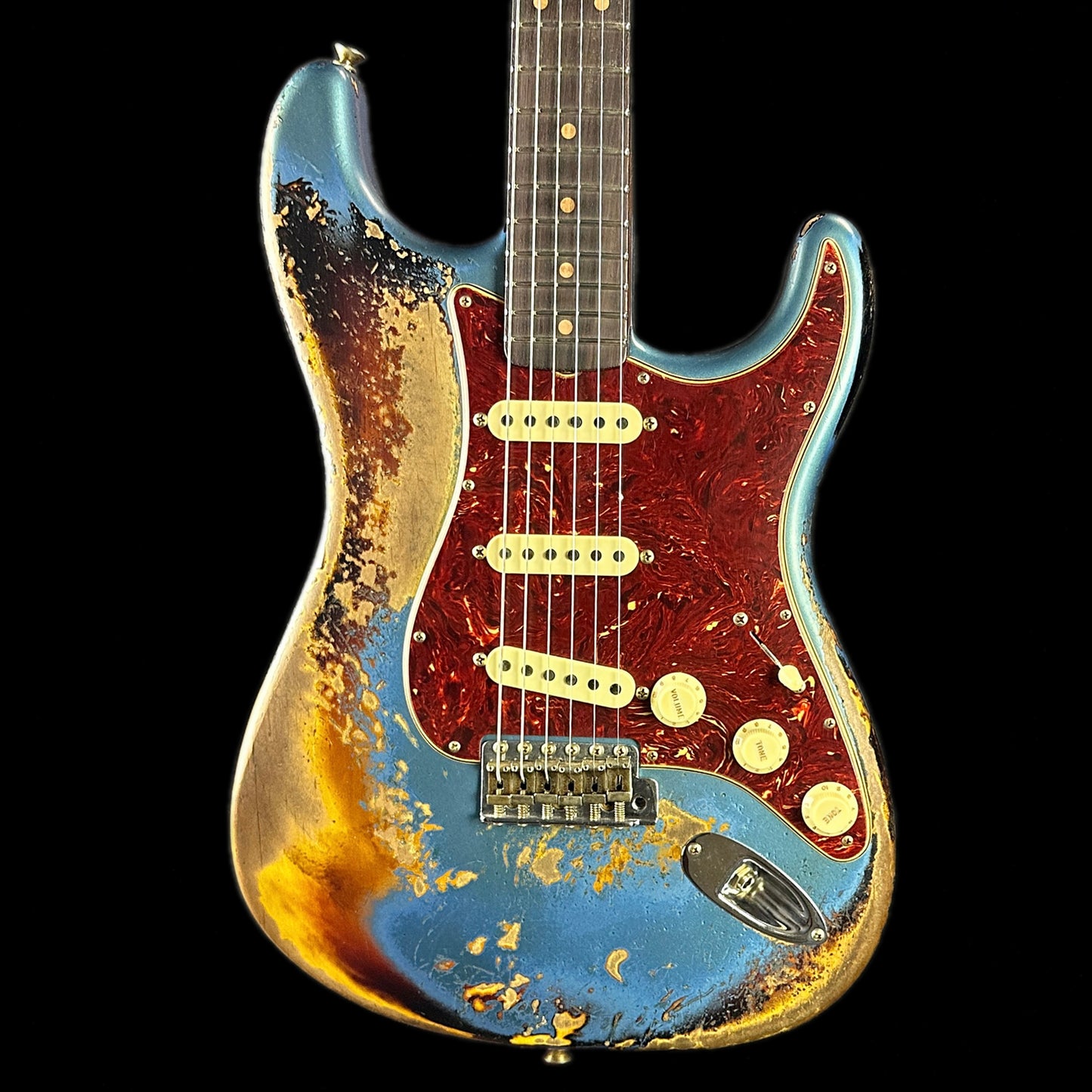 Front of body of Fender Custom Shop Limited Edition Roasted '60 Strat Super Heavy Relic Aged Lake Placid Blue Over 3 Color Sunburst.