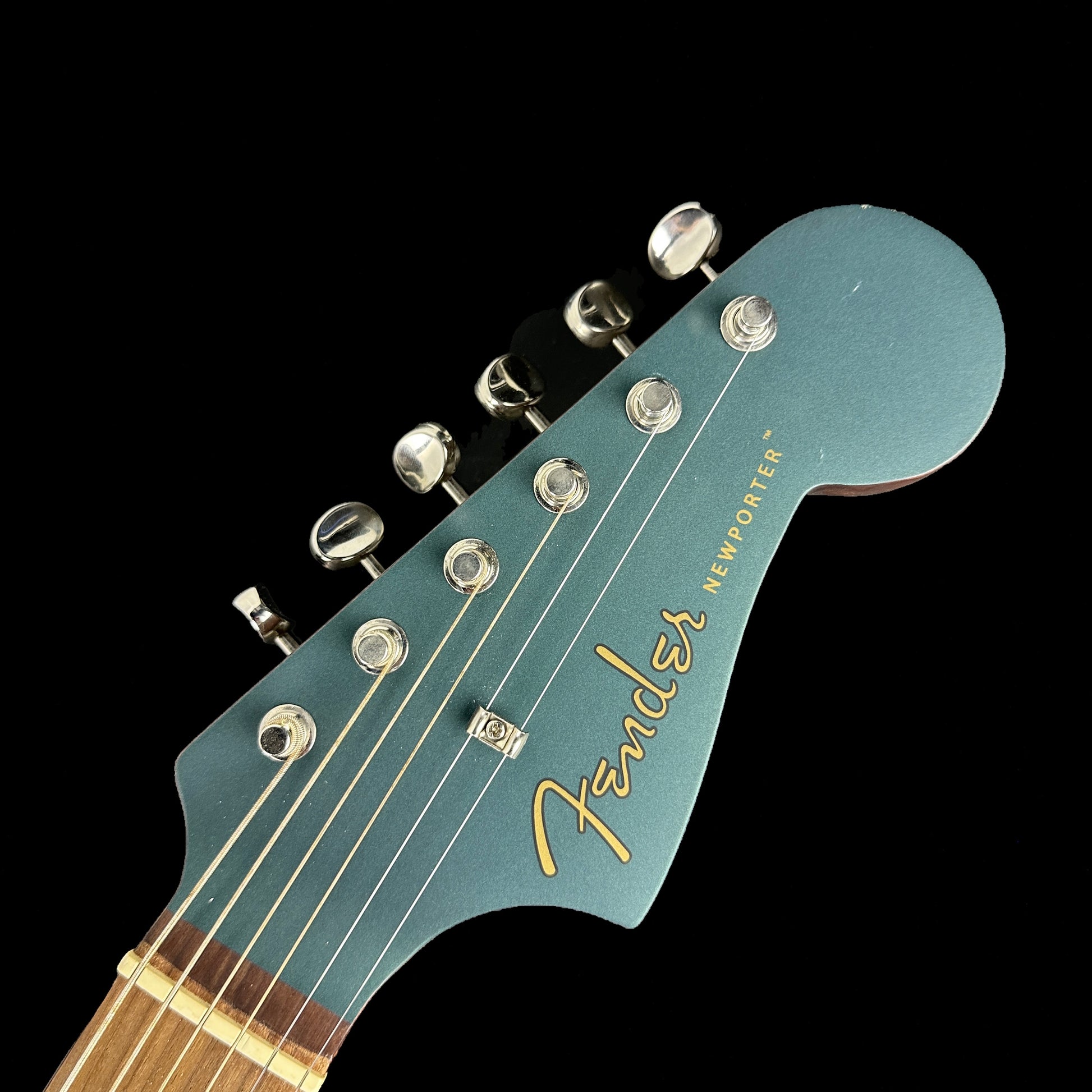 Front of headstock of Used  Fender Newporter Player Ocean Teal.