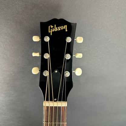 Front of headstock of Used 2010 Gibson 60s J-45 Original Ebony Adi Top.
