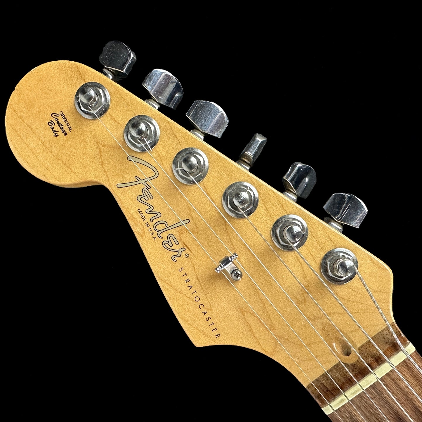 Front of headstock of Used 2010 Fender American Standard Strat Left Hand Blizzard Pearl.