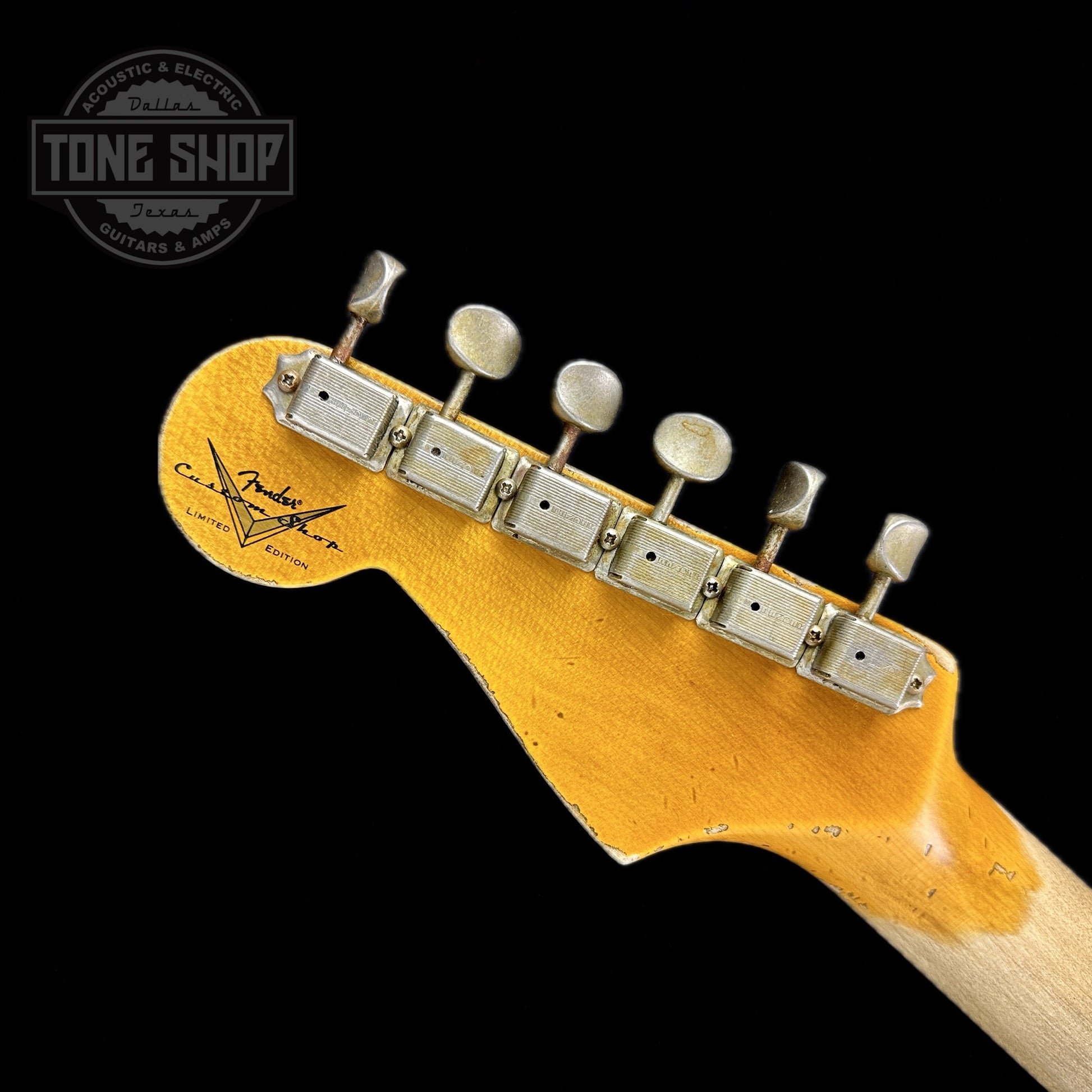 Back of headstock of Fender Custom Shop Limited Edition 61 Bone Tone Strat Super Heavy Relic Super Faded Aged 3 Color Sunburst.