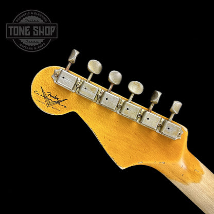 Back of headstock of Fender Custom Shop Limited Edition 61 Bone Tone Strat Super Heavy Relic Super Faded Aged 3 Color Sunburst.