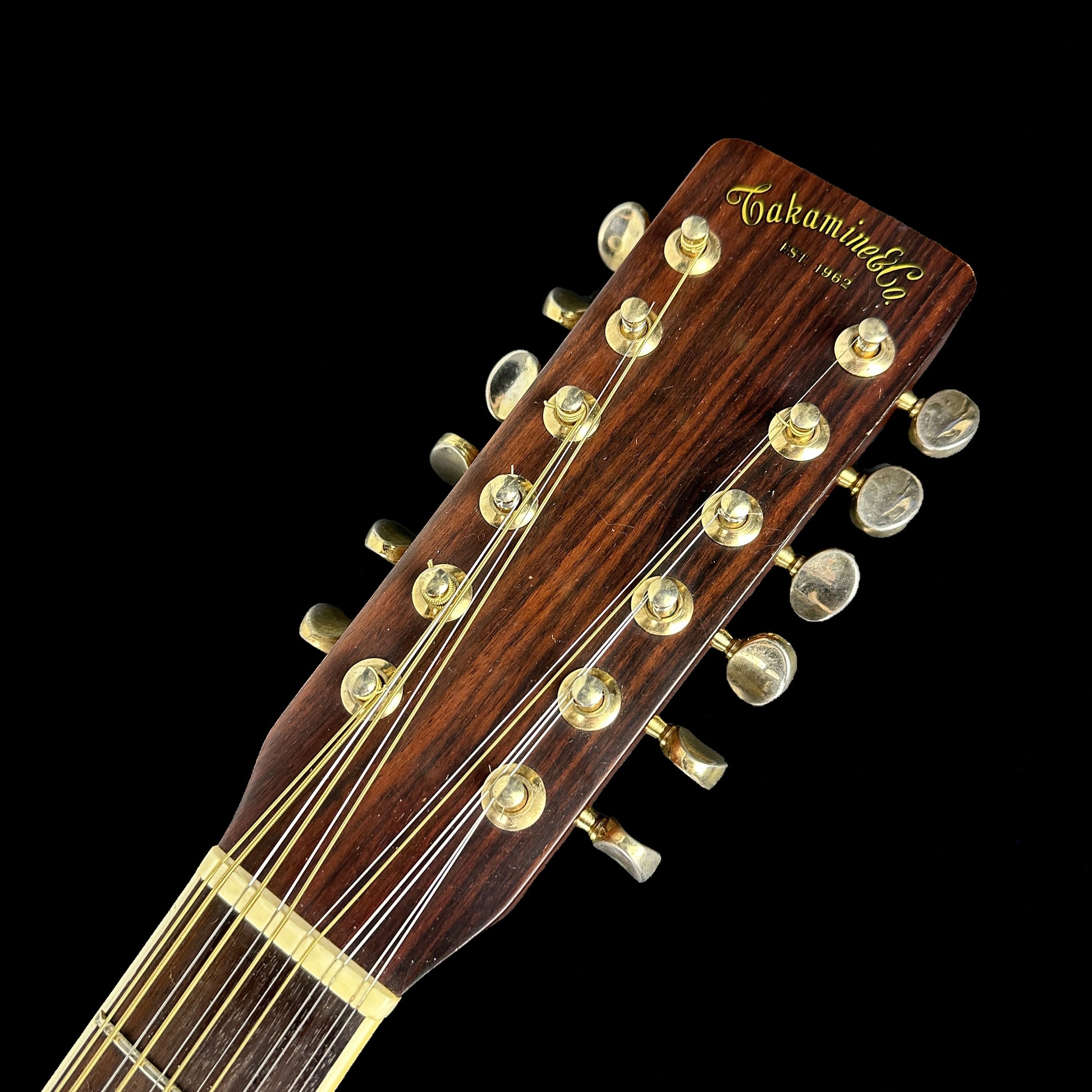 Front of headstock of Used Takamine F400S 12 String.