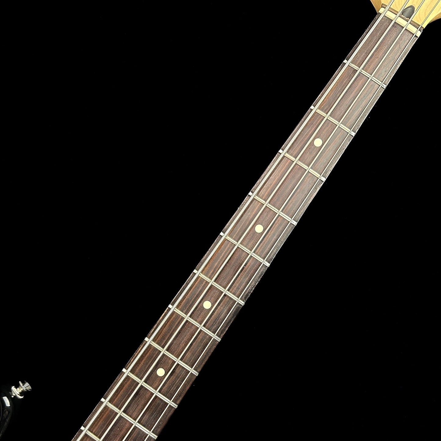Fretboard of Used Fender Standard Jazz Bass Black.