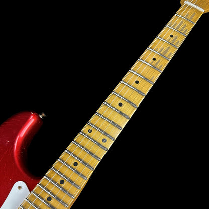 Closeup of Fender Custom Shop 58 Strat Relic Faded Aged Candy Apple Red fretboard.