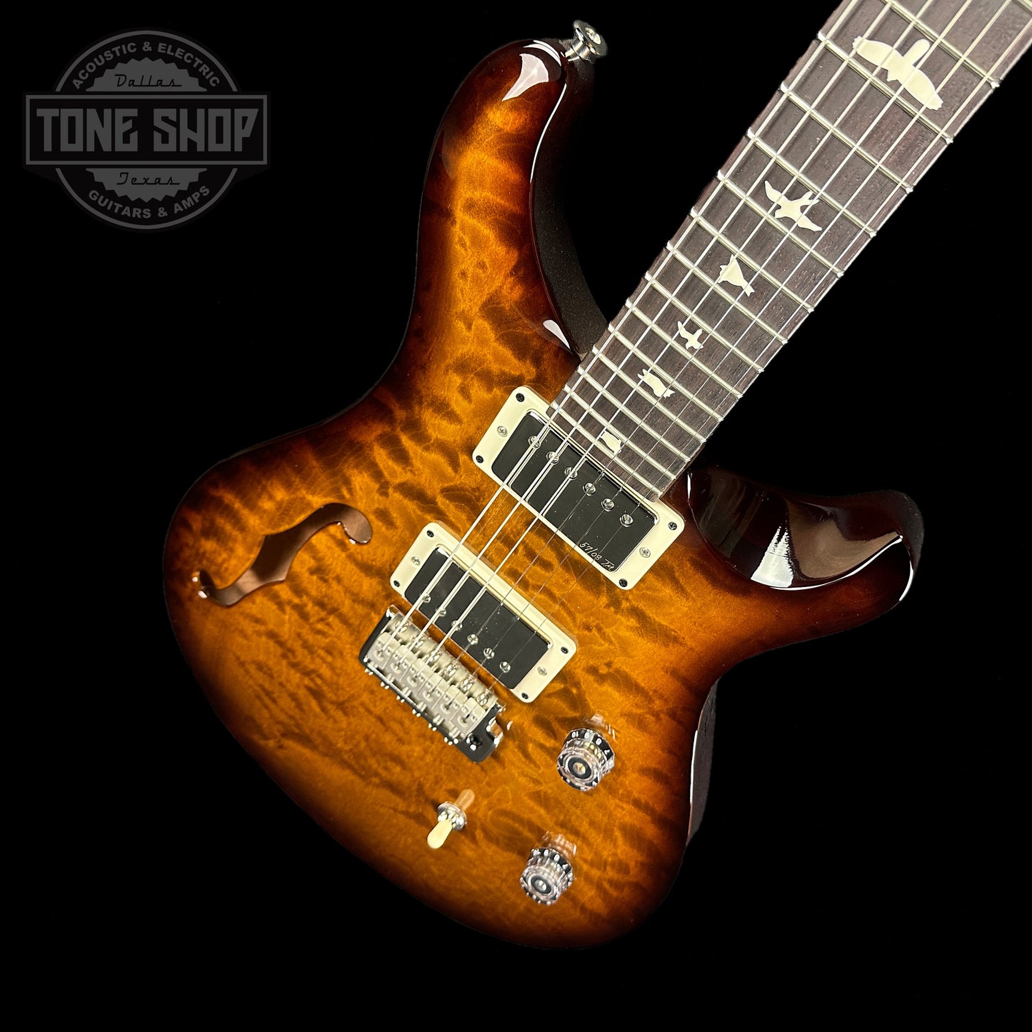 Front angle of PRS Paul Reed Smith CE24 Semi-Hollow Quilt Black Amber.