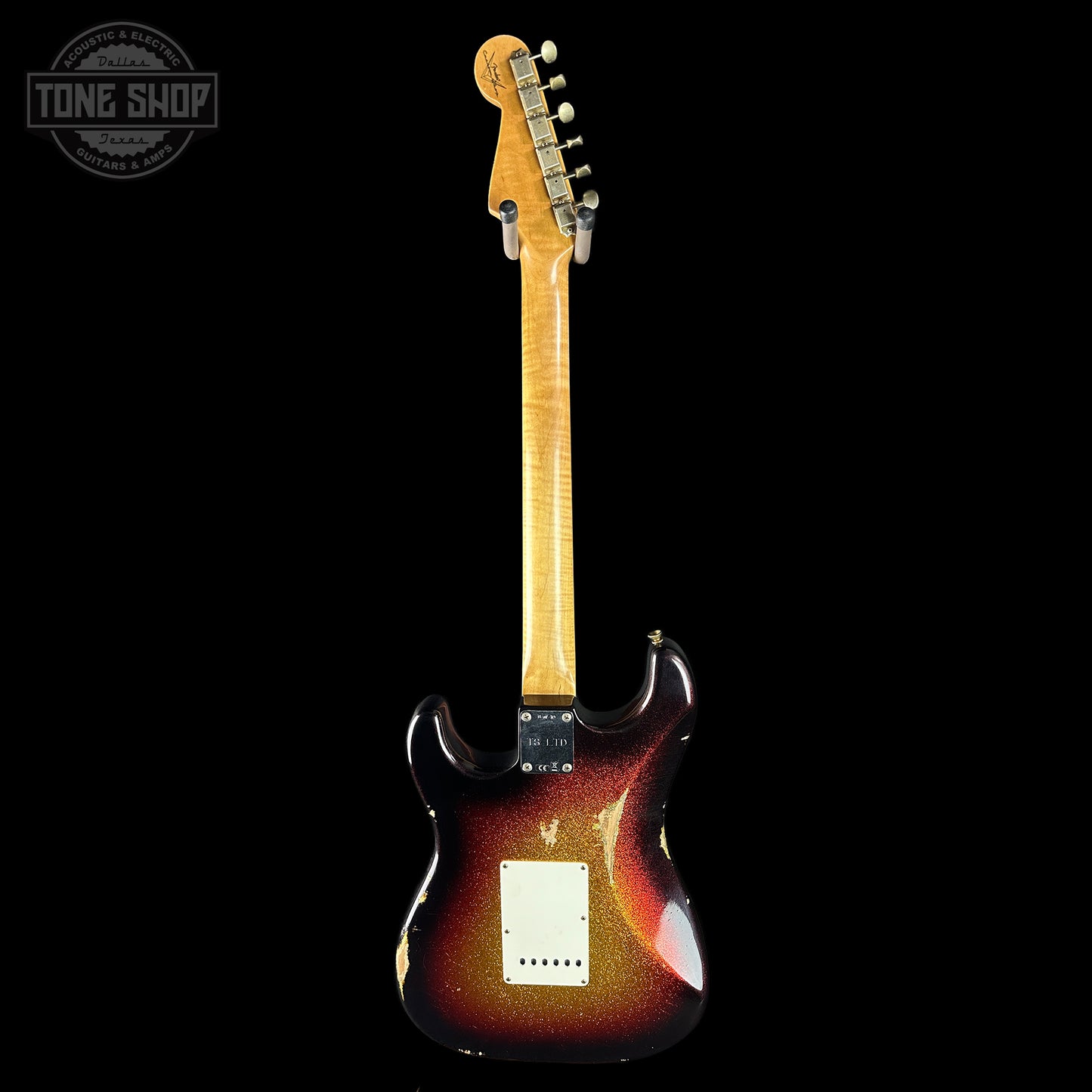 Electric guitar with a sunburst finish on a black background, featuring the Tone Shop logo.